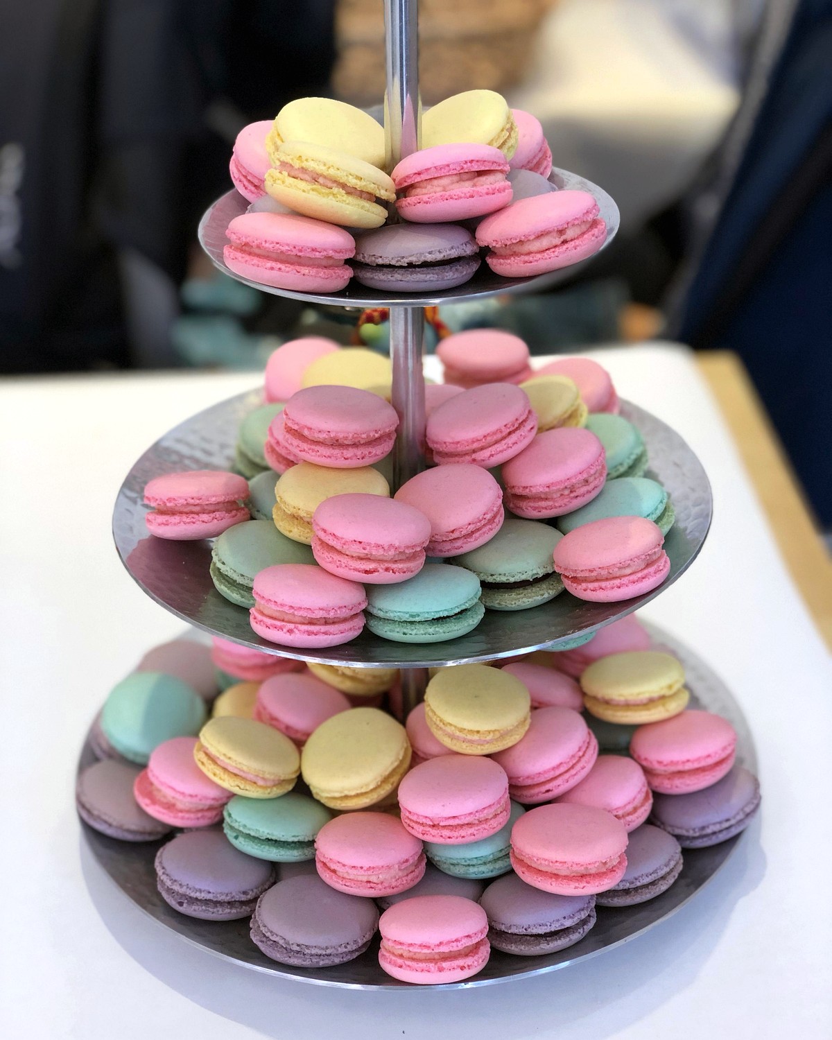 French macarons arranged on tiered glass stands